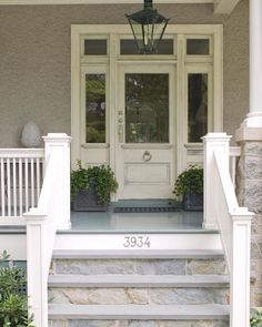 a front porch with steps leading up to the door