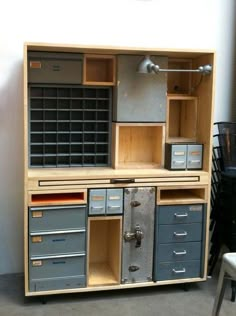 an old fashioned computer desk with many drawers