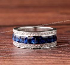 💓 𝗜𝘁𝗲𝗺 𝗗𝗲𝘁𝗮𝗶𝗹𝘀 💓 💫 𝐓𝐈𝐓𝐋𝐄 💫 Men's Blue Sapphire Ring, Perfect Gift For Him, 2.0Ct Gemstone Ring, 14K White Gold, Men Wedding Engagement Ring, Surprise Anniversary Gift Main Stone: Sapphire & Diamond  Carat Weight: 2.0 Ct Clarity: VVS1 Metal: 14K White Gold 💫 Available in 925 Sterling Silver (SS), 935 Argentium Silver (AS)                            14K White Gold Plated, 14K Rose Gold Plated, 14K Yellow Gold Plated                            10K White Gold, 14K White Gold, 18K White Gold 💫 𝐂𝐔𝐒𝐓𝐎𝐌𝐈𝐙𝐀𝐓𝐈𝐎𝐍 💫   1. Ring Resizing All Ring Size Available 2. jewelry as per your requirement, we just need photos and description, and we will make it for you.  3. Metal Change 4. Engraving ✒️ (Name or any message - no of characters subject to size of jewelry)   💫 𝐒? Mens Rings With Saphire, Luxury Unique Blue Men's Ring, Luxury Sapphire Men's Ring With Accent Stones, Luxury Elegant Sapphire Men's Ring, Luxury Men's White Gold Sapphire Ring, White Gold Sapphire Ring, Romantic Photoshoot, Wedding Engagement Ring