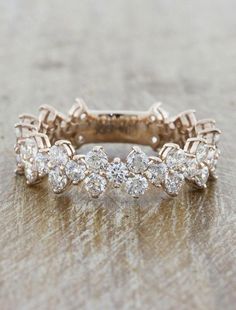 this is an image of a wedding ring with diamonds on the side and in the middle