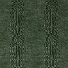 a green rug with wavy lines on it