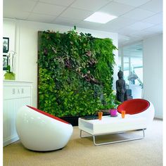 a living room with a large green wall