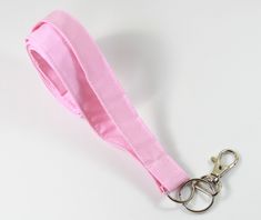 This cute lanyard has beautiful pink. This lanyard is very beautiful in person. You can have a wardrobe of lanyard to match your outfit. This lanyard is made of soft 100% cotton fabric to give a comfortable feel around your neck. This lanyard is easy to take care. You can spot clean and throw in a washer and hang dry. If you want you can iron and it is ready to use. These lanyards are perfect if you have metal allergy. Each of these lanyards will have a slight different pattern depending on wher Rectangular Pink Badge Holders For Everyday Use, Pink Lanyard With Key Leash For Gift, Lanyard Pink, Cute Lanyard, Pink Plain, Cute Lanyards, Pink Keychain, Fabric Lanyard, Plain Fabric