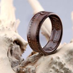 a wooden ring sitting on top of a rock