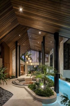 the inside of a modern house with an indoor swimming pool