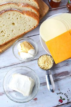 bread, cheese and butter are on the table