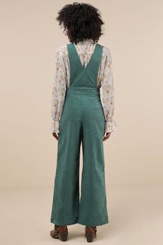 It's easy to become a layering expert when you have a perfect piece like the Lulus Autumn Energy Green Corduroy Wide-Leg Overall Jumpsuit! This sturdy woven corduroy jumpsuit has an overall-inspired design that will pair seamlessly with all your favorite turtlenecks. The sleeveless bodice features a plunging V-neckline and wide shoulder straps, atop a banded waist with a brown button closure and a hidden zip fly. Trendy wide legs boast decorative flap pockets (with matching brown buttons), convenient side seam pockets, and ankle-length hems. Fit: This garment fits true to size. Length: Floor length. Size medium measures 57" from shoulder to hem. Inseam: 29.00 Front Rise: 14.50 Bust: Great for any cup size. Waist: Fitted - very fitted at natural waist. Hip: Loosely Fitted. Fabric: Fabric ha Wishlist Board, Corduroy Jumpsuit, Overall Jumpsuit, Green Corduroy, Fashion Wishlist, Wide Legs, Ankle Length, Shoulder Straps, Floor Length