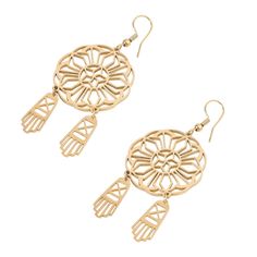 two pairs of gold tone earrings with intricate designs and dangling earwires on white background