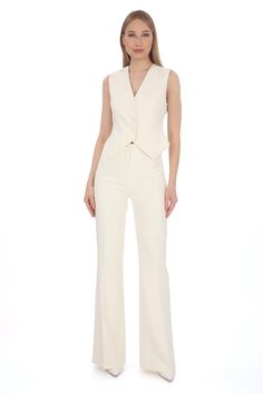 Elevate your professional wardrobe with our Womens Ivory Slim Fit Vest and Flare Pants Suit. This sophisticated ensemble is designed for the modern woman who values style and professionalism. Made from premium materials, the slim-fit vest pairs elegantly with the flare pants, offering a flattering silhouette that enhances your confidence in any business setting. Whether you're leading a meeting or attending a networking event, this outfit ensures you look polished and poised. Key Features: Slim fit vest with a tailored finish Flare pants for a stylish look Ideal for business meetings, presentations, and formal events Versatile ensemble suitable for day-to-evening wear Available in [sizes and colors available] Add a touch of elegance to your workwear collection with our Womens Ivory Slim Fi Flare Formal Pants Outfit, Women’s Vest Suit, Elegant Structured Fitted Pantsuit, Elegant Fitted Structured Pantsuit, Elegant White Dress Pants For Formal Occasions, Tailored Beige Pantsuit For Office, Elegant White Dress Pants For Work, Beige Notch Lapel Pantsuit For Work, Elegant Tailored Beige Pantsuit