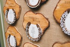 wooden slices with names are arranged on a table