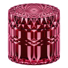 a red glass container with an intricate design