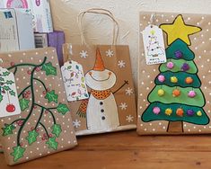 three bags decorated with christmas cards and decorations