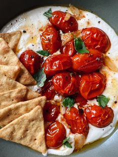 tomatoes and pita chips on a plate