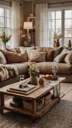 a living room filled with lots of furniture and pillows on top of a wooden table