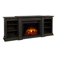 an entertainment center with a fireplace and shelves