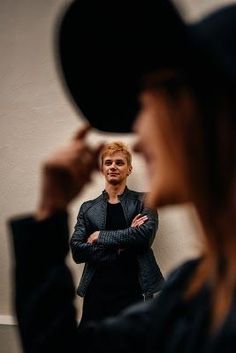 a woman looking at herself in the mirror