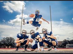 an image of a football player jumping in the air with his hands out to catch the ball