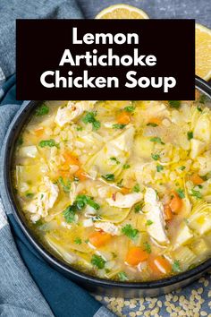 lemon artichoke chicken soup in a black bowl on a blue and white checkered cloth