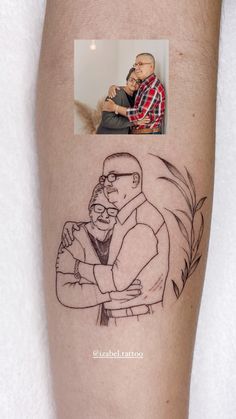 a man's arm with an image of his father and son on it