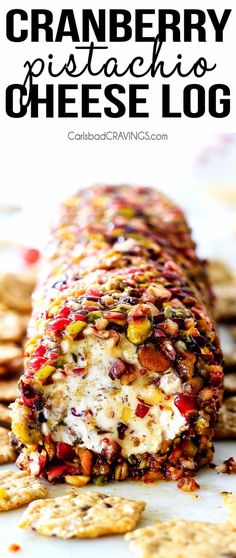 cranberry pistachio cheese log with crackers on the side and text overlay