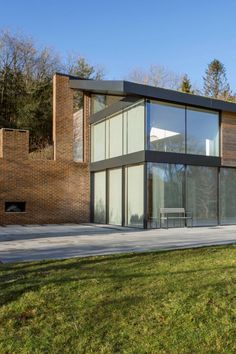 Expansive architectural glazing package seen in this contemporary dwelling built on a sloping site including a structural glass roof Underground Section, Casement Window, Replacement Windows, Storey Homes, Window Sizes, Floor To Ceiling, Modern Windows, Glass Roof