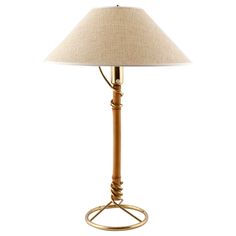 a table lamp with a beige shade on it's base and a gold metal ring around the base