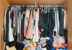 a closet filled with lots of different types of clothes