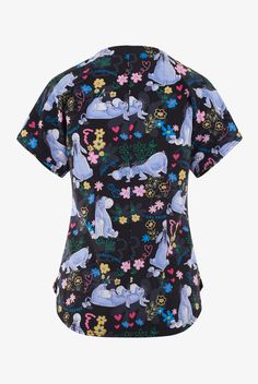 Tooniforms Disney s Eeyore Dreams Women s 2-Pocket STRETCH V-Neck Print Scrub Top • Contemporary fit • Notch neck with contrast lace up • 2 front patch pockets • Short dolman sleeve • Self double utility loop above right pocket • Center back seam • Back darts • Shirttail hem • Eeyore from Disney s The Many Adventures of Winnie the Pooh happily day dreaming of beautiful colorful flowers on a black background with pewter blooms • Approximate length for size M is 27 3 4 • Manufacturer style TF787-P Mandala Scrubs, Purple Scrubs, Purple Scrubs Uniform, Patterned Scrubs, Disney Scrubs, Black Friday In July, Disney Scrub Tops, Scrub Jackets, Scrub Pants