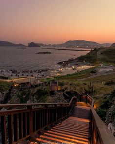 stairs lead down to the beach at sunset