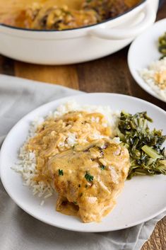 a white plate topped with chicken and rice next to a pot of broccoli