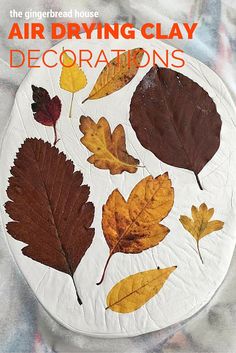 an air drying clay decoration with autumn leaves on it and the title above it reads, the ginghead house