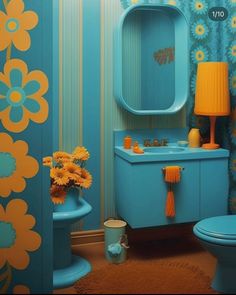 a blue bathroom with yellow flowers on the walls