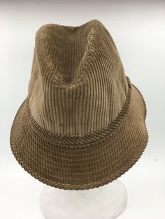 Men's Vintage Bucket hat by Oxford hats circa 1960. Beige hat in 100% cotton corduroy,  quilted lining, and inside sweat rim.  Downturned brim with stitching to keep its shape. made in France Excellent condition-dead stock original tags attached.    Circumference 55.00 cm, the height of 10.00 cm, brim 5.00 cm.  To determine your hat size, measure the circumference around your head with a measure tape or string, keeping the string level and firm, across the temples and above the eyebrow ridges. M Vintage Hats For Outdoor, Vintage Bucket Hat With Flat Brim For Outdoor, Vintage Flat Brim Bucket Hat For Outdoor, Vintage Winter Bucket Hat With Curved Brim, Vintage Brown Brimmed Bucket Hat, Vintage Brown Wide Brim Bucket Hat, Winter Vintage Bucket Hat With Curved Brim, Vintage Brown Bucket Hat, Vintage Cotton Bucket Hat With Flat Brim