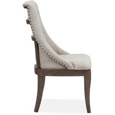 an upholstered chair with buttons on the back and arms, in grey fabric