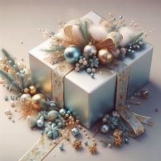 a white present box with blue and gold ornaments on it's side, surrounded by ribbon