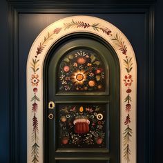 the door is decorated with flowers and leaves