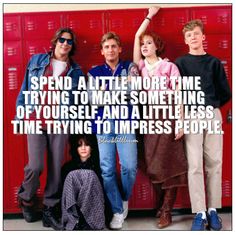 some people are standing in front of lockers and one has a quote on it