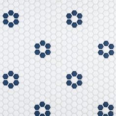 a white and blue tile with hexagonal shapes on it's surface is shown