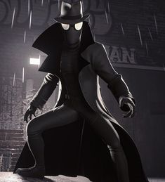 a man dressed as batman standing in the rain with his hands on his hips while wearing a black suit and hat