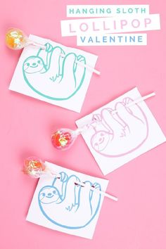 three lollipops with sloth faces on them and the text hanging sloth lollipop valentine