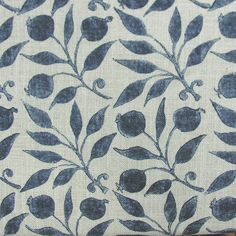 a blue and white fabric with leaves on it