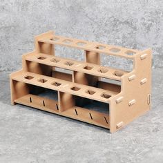 a wooden shelf with several compartments on it