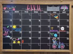 a chalk board with the calendar drawn on it