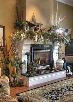 a fireplace decorated for christmas with greenery and stars on the mantel above it