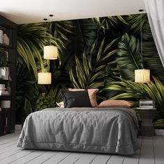 a bedroom with a bed, lamps and palm leaves wallpaper on the walls behind it