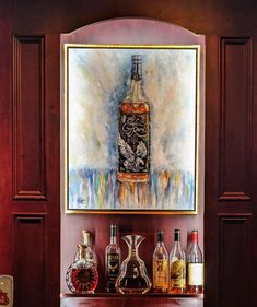 a painting hanging on the wall next to liquor bottles