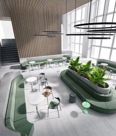 a room with tables, chairs and plants in it