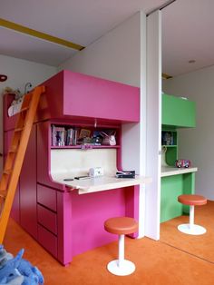 a pink and green bunk bed sitting next to a counter top in a room with stools