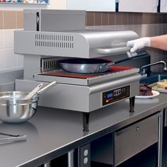 a person in white gloves is preparing food on a counter top with pots and pans