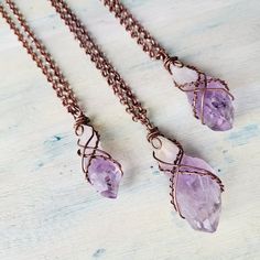 "Raw Amethyst Quartz necklaces. Oxidised Copper Wire wrapped beautiful good quality Amethyst Crystal necklace. Layers great with other necklaces. Love stone necklace. February birthstone. Choose your necklace length with a choice of 16\", 18\", 20\", 22\", 24\", 30\", 32\". These are Raw Natural Gemstones and vary in shape, color and size, each one is unique in its own way. Amethyst is a meditative and calming stone which works in the emotional, spiritual, and physical planes to provide calm, balance, patience, and peace. Amethyst is used as beneficial when dealing with legal problems and money issues, which can lead to prosperity and abundance, though it is not the best known prosperity stone. Emotionally, amethyst is used in crystal healing to help heal personal losses and grief, bringin Handmade Purple Crystal Necklaces, Rough Stone Wire Wrap, Luxury Wire Wrapped Spiritual Jewelry, Luxury Wire Wrapped Healing Jewelry, Hand Wrapped Purple Copper Necklace, Amethyst Wire Wrapped Necklace Gift, Electroformed Amethyst Crystal Necklace As Gift, Hand Wrapped Amethyst Crystal Necklace For Gift, Purple Wire Wrapped Copper Wire Necklace